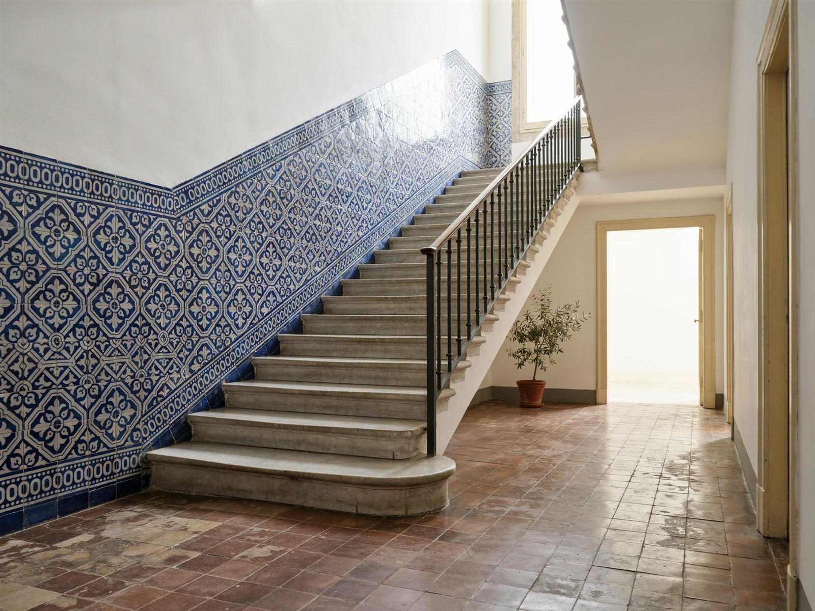 Granite staircase and azulejo entrance hall after stone cleaning